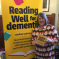 Fiona Bruce MP in front of a 'Reading Well for Dementia' Banner