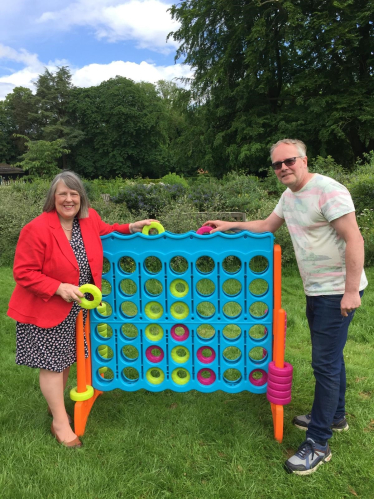 Fiona Bruce and Glen Williams with a giant connect 4 garden game